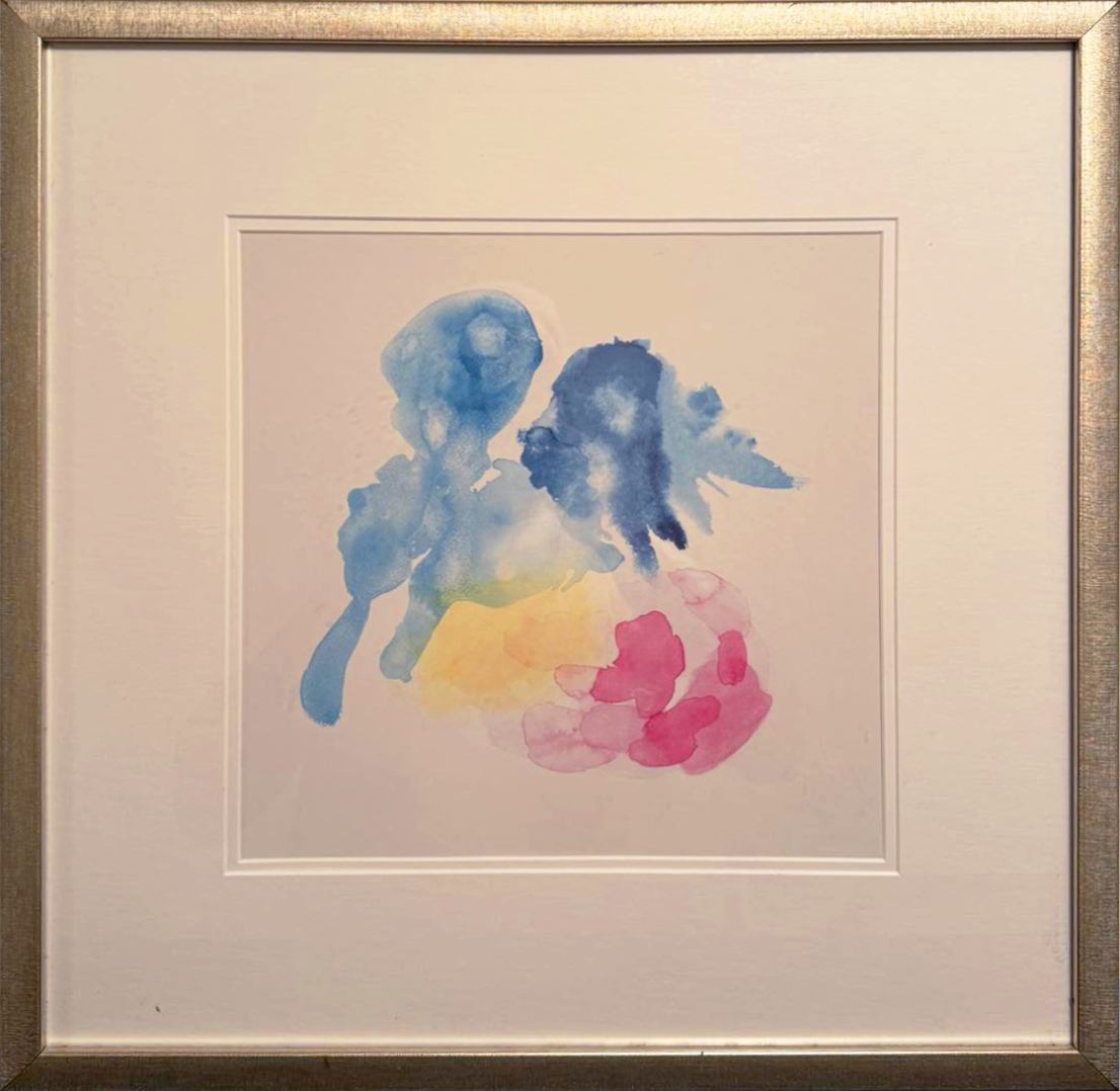 The gentle and fluid nature of abstract watercolour art, through soft hues and delicate brushstrokes makes the splashes of blue, pink, and yellow interact in a harmonious yet subtle dance, inviting viewers to interpret the scene through their personal lens.