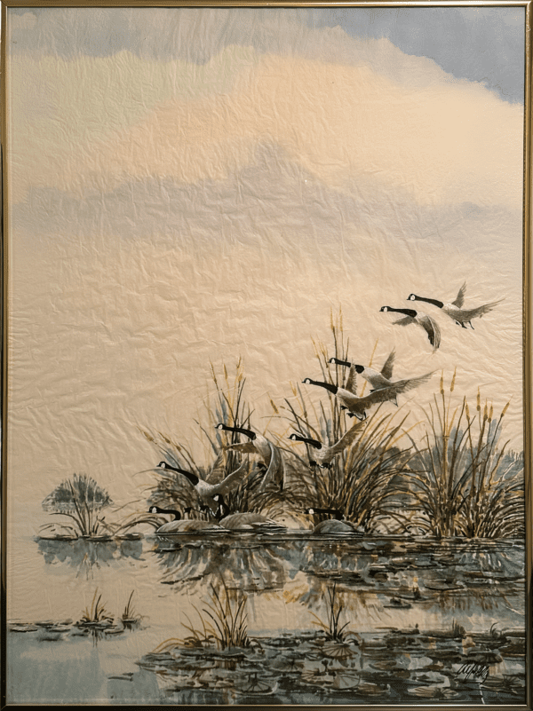 The peaceful scene of beauty in a still pond where a group of Canadian geese takes flight - warms the muted colours of the sky and water that creates a tranquil atmosphere. The reflections of the geese mirrored on the water's surface brings natural depth to the composition, where motion and stillness harmonize.