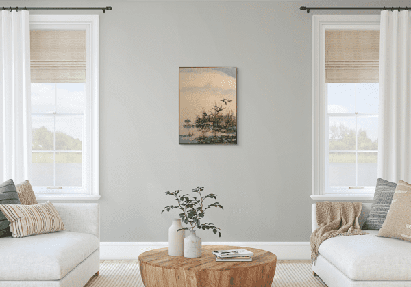 The peaceful scene of beauty in a still pond where a group of Canadian geese takes flight - warms the muted colours of the sky and water that creates a tranquil atmosphere. The reflections of the geese mirrored on the water's surface brings natural depth to the composition, where motion and stillness harmonize.