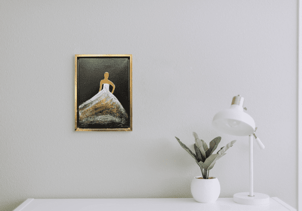 This painting featuring the graceful silhouette of a woman adorned in a luxurious gown, textured with layers of gold and white hues. The faceless figure, rendered in gold, suggests a timeless, universal femininity, leaving her identity to the imagination of the viewer. 