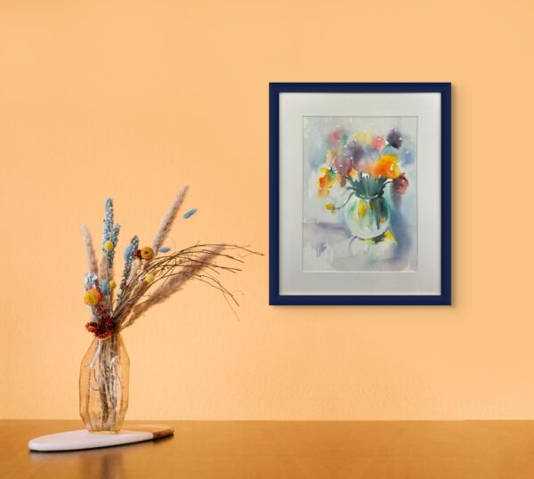 This gentle and vibrant watercolor painting showcases a bouquet of flowers in a round glass vase. With soft, flowing colors a feeling evokes the freshness of spring. Perfect for adding a splash of color to any room.