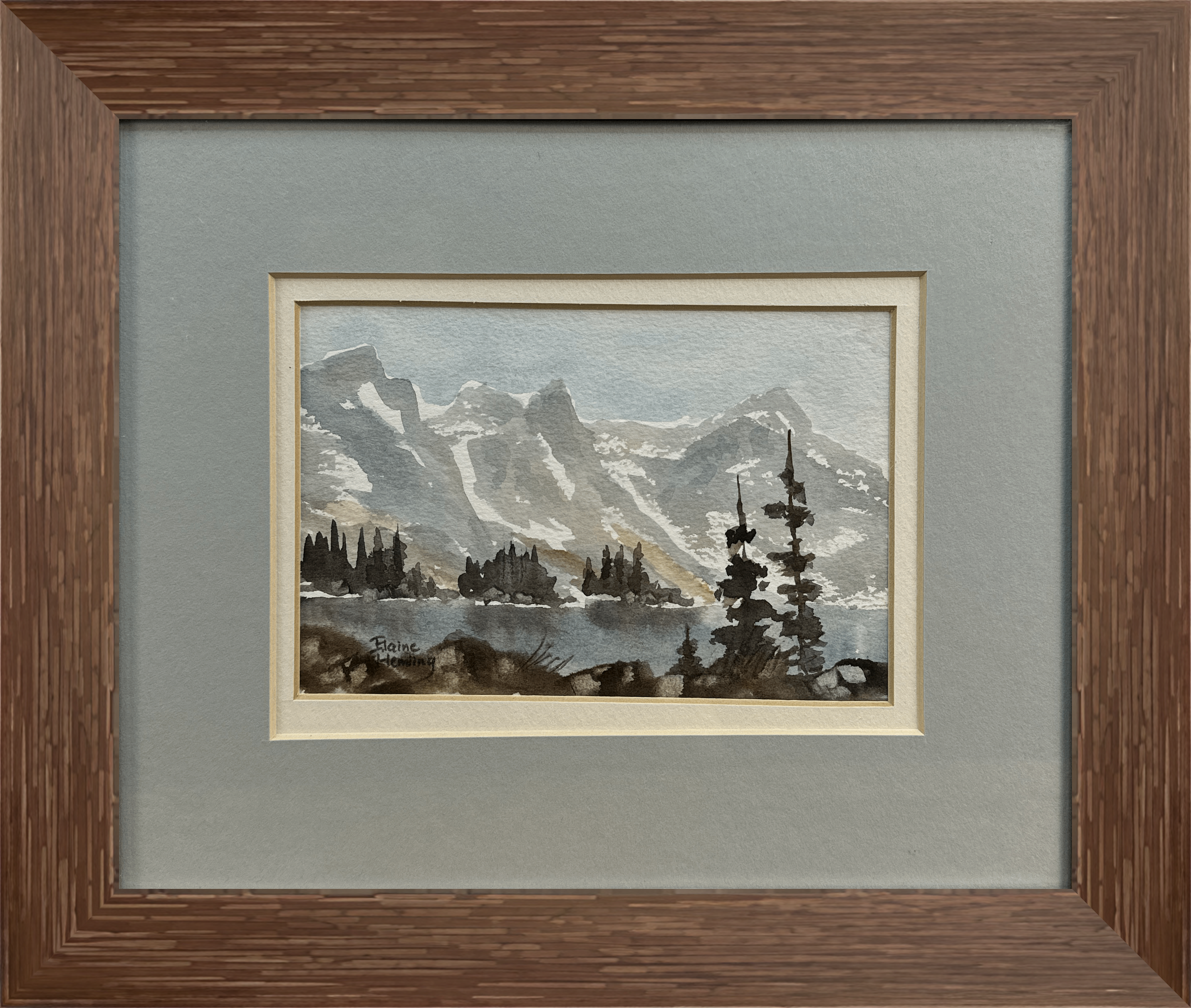 This watercolor captures the tranquil beauty of towering mountains reflected in a still lake, with a foreground of rugged pines. The muted tones evoke a peaceful, misty morning in the wilderness.