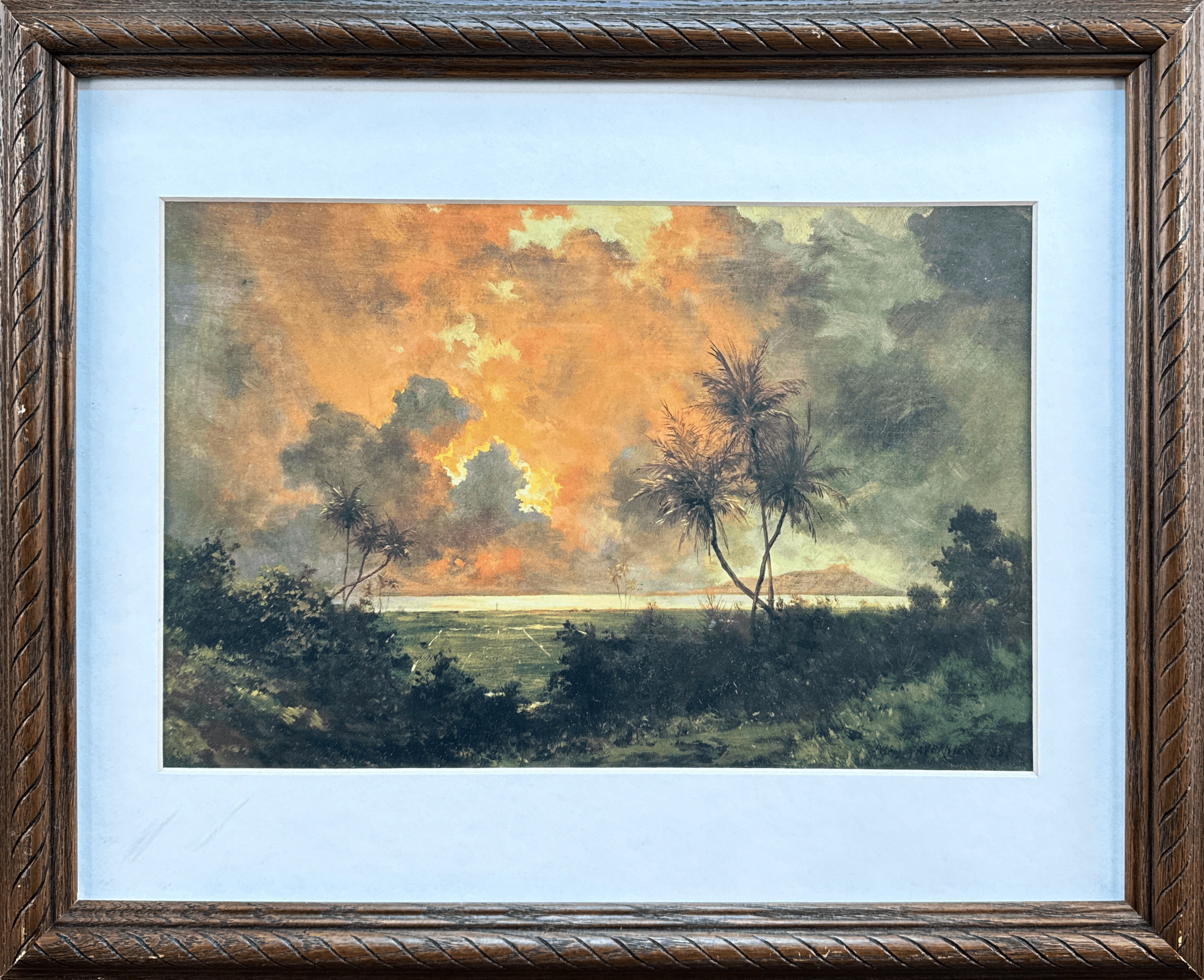 This stunning landscape captures a fiery sunset over a tropical scene, with silhouetted palm trees and dense greenery. The vibrant orange and golden hues fill the sky, casting a warm glow across the horizon and evoking a sense of tranquility.